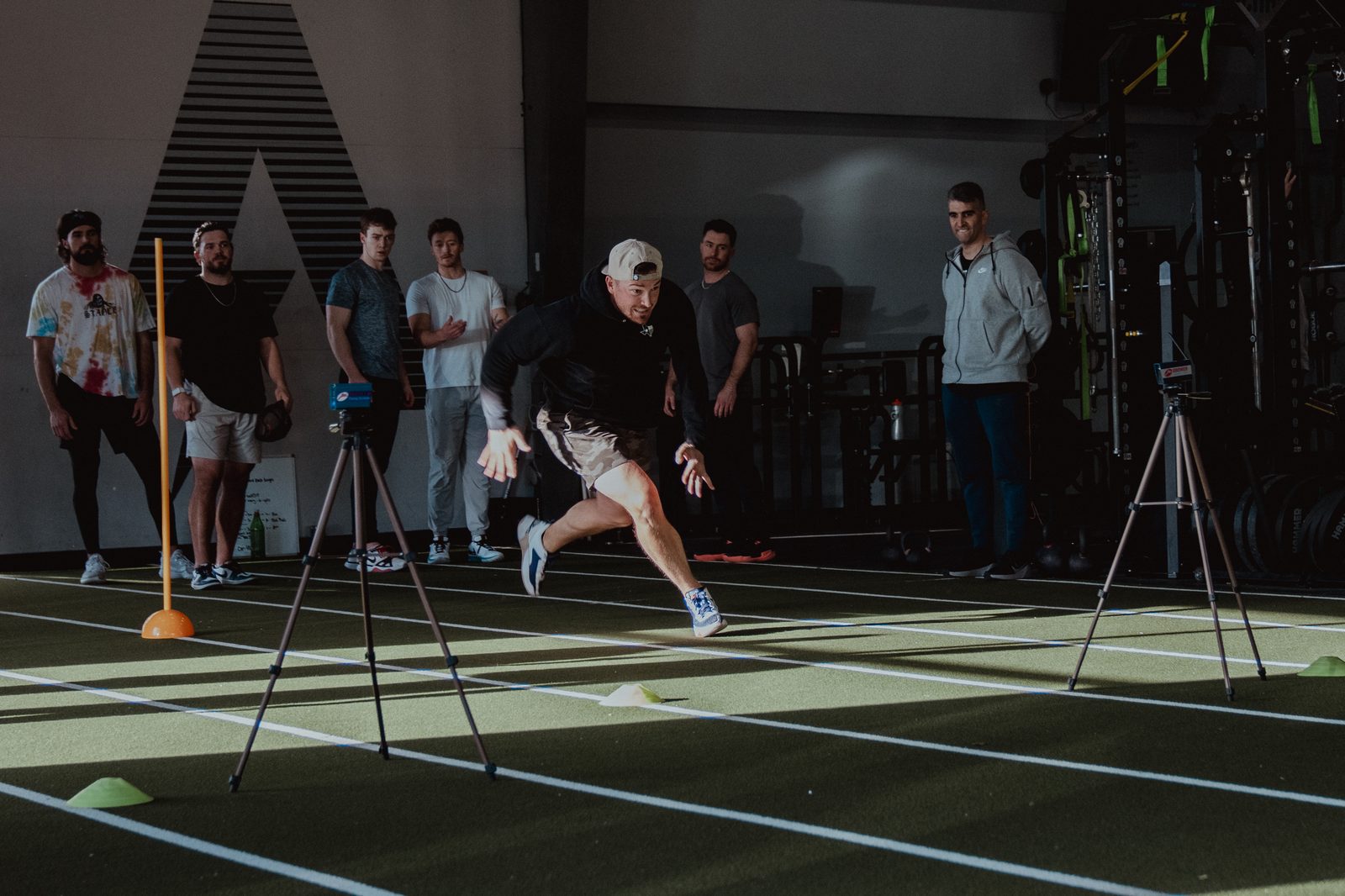 An athlete running the laser-timed sprint at APEC