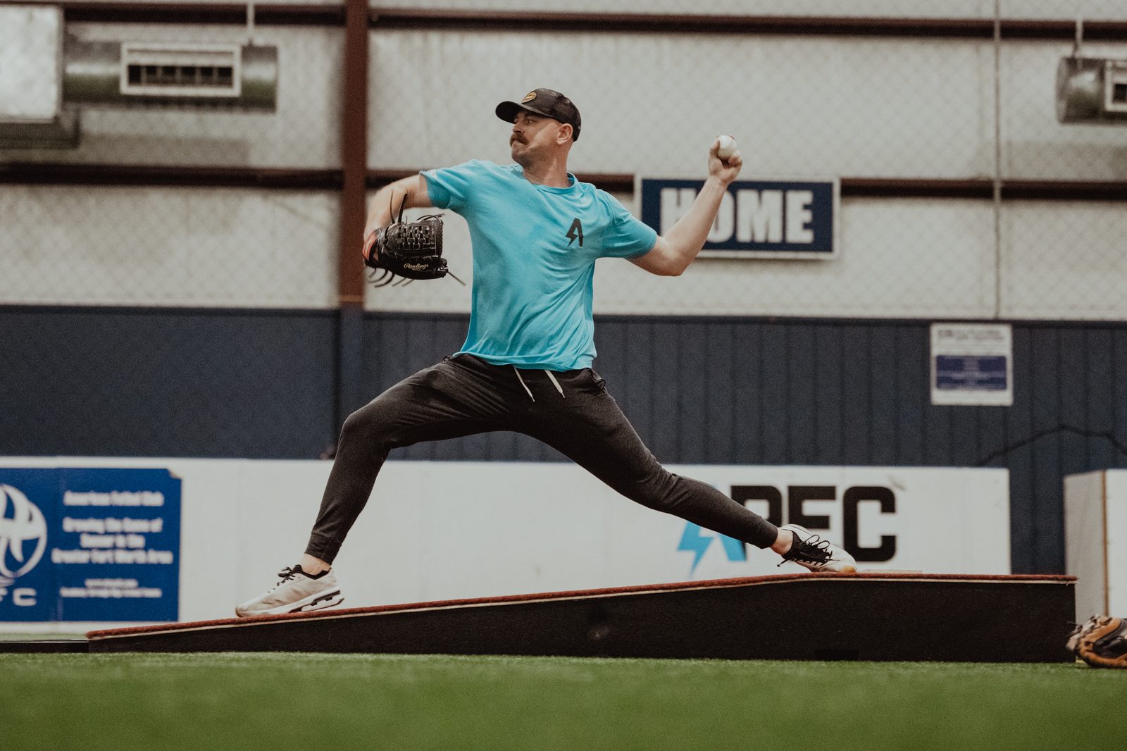 APEC pitching coach demonstrating delivery off the mound