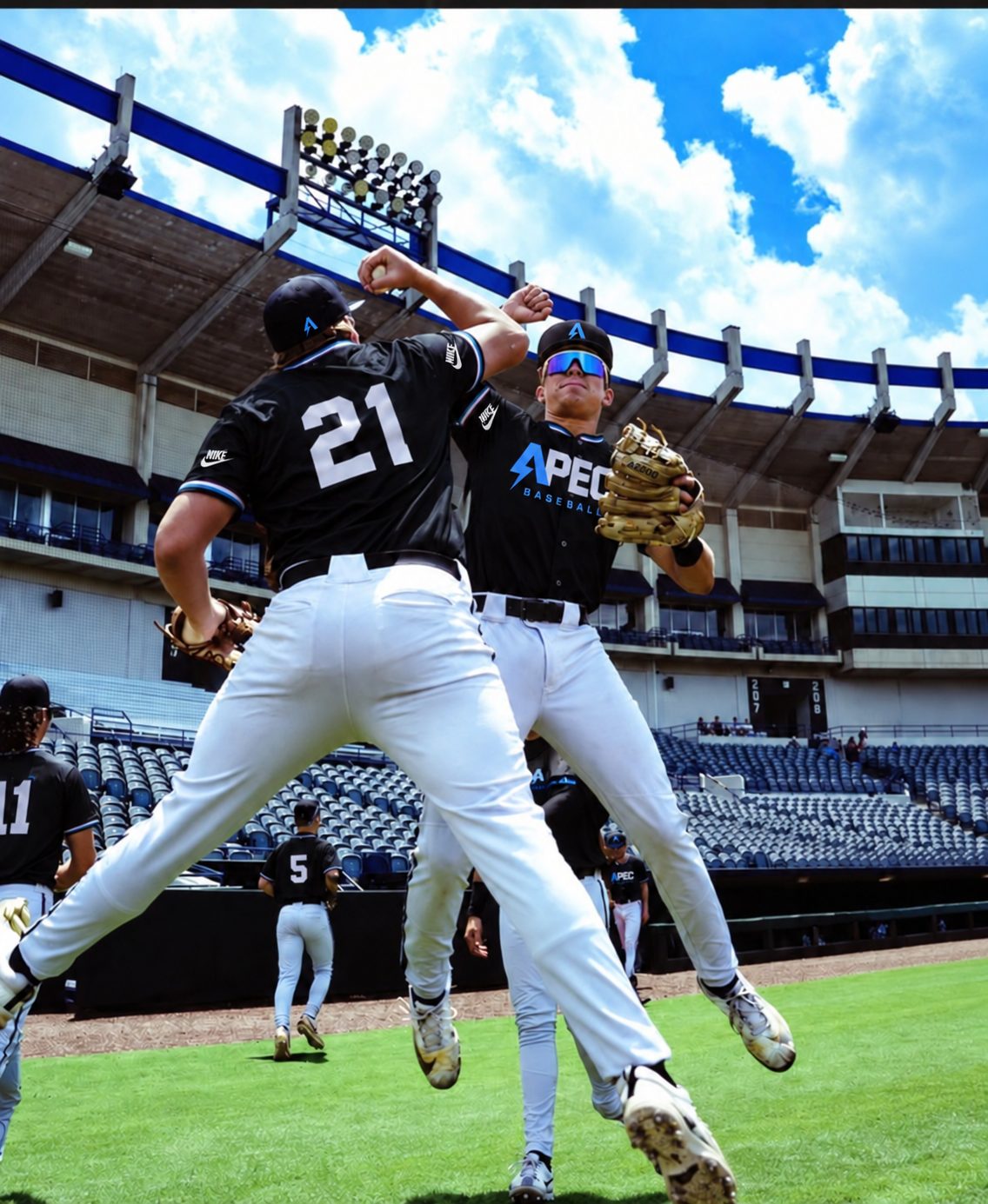 Two APEC Baseball players celebrating on the field